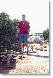 Raphael Bingert balancing on a log